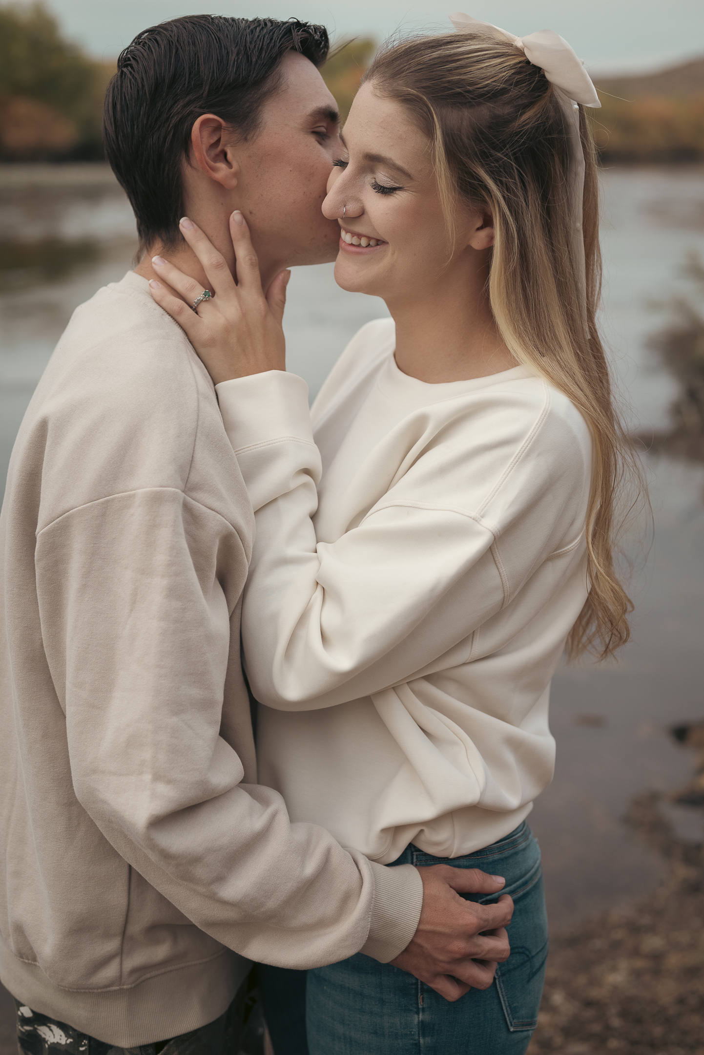 Engaged couple embrace lovingly for photo session along the Lower Salt River in Arizona