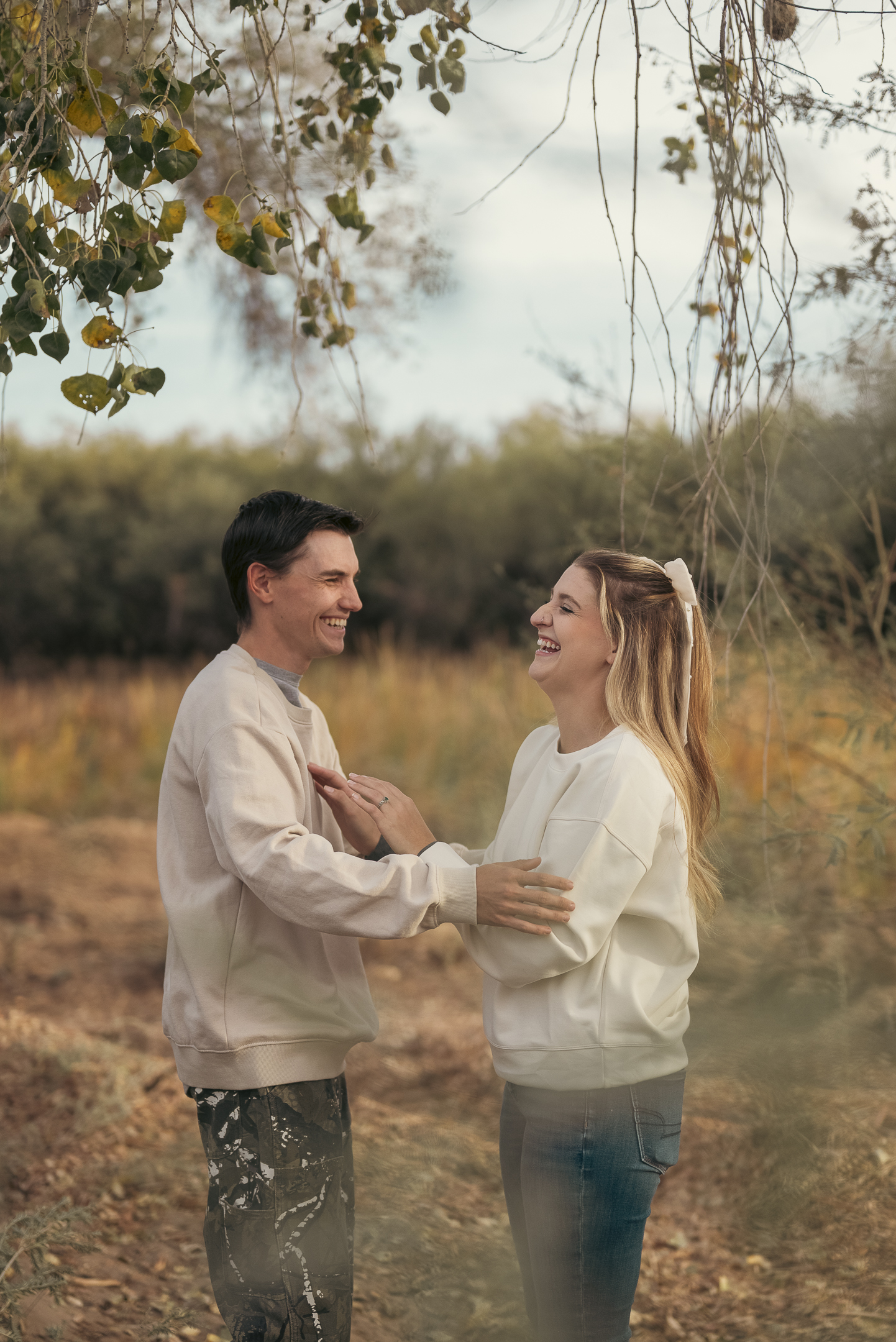 Couple sharing in laughter at engagement session in Apache Junction, Arizona