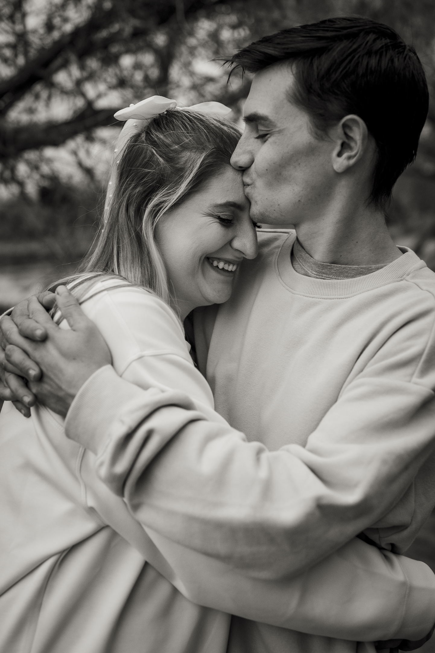 Black and white photo of couple's loving, happy embrace