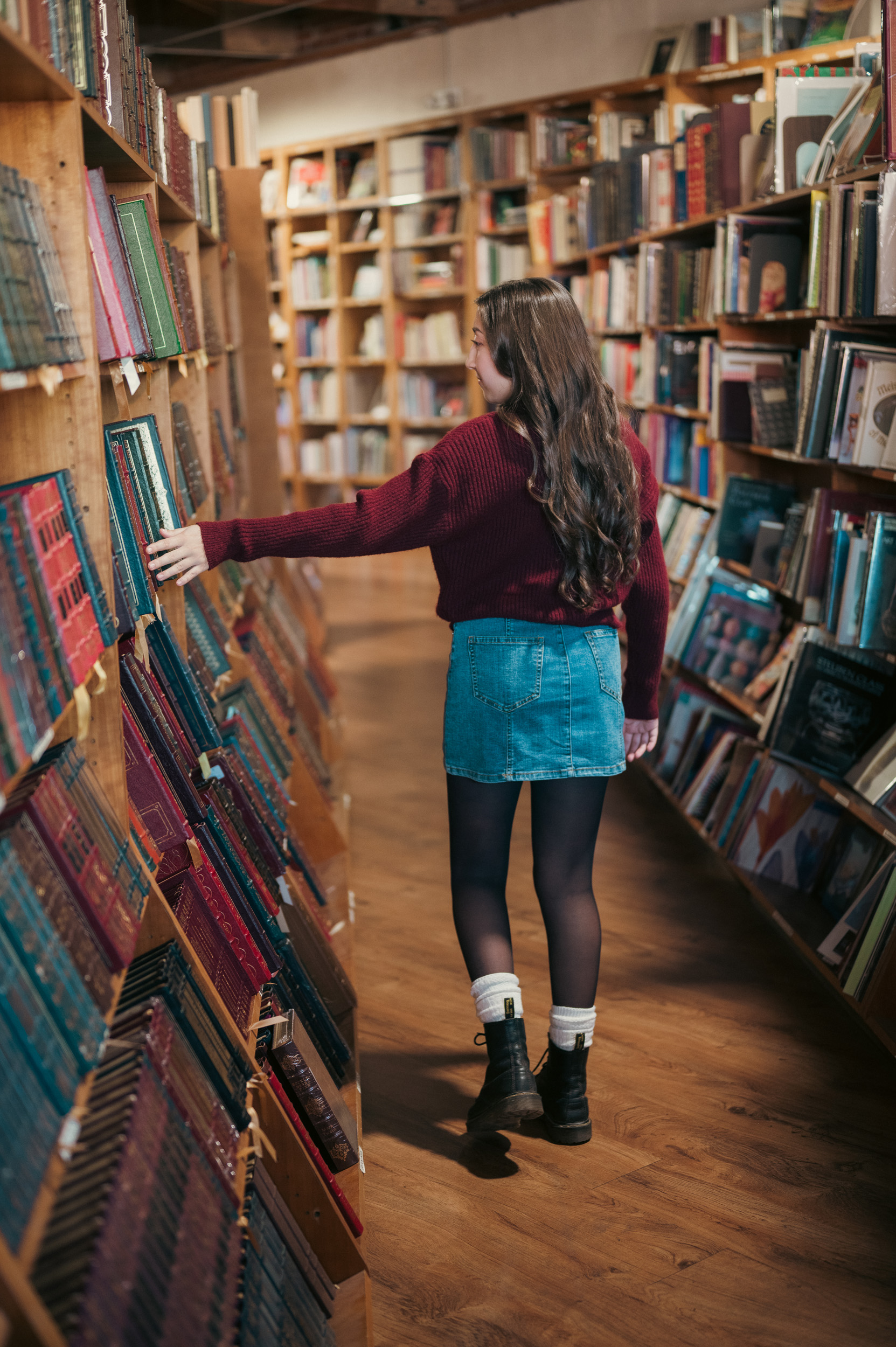 Girl walking through Phoenix Book Gallery.