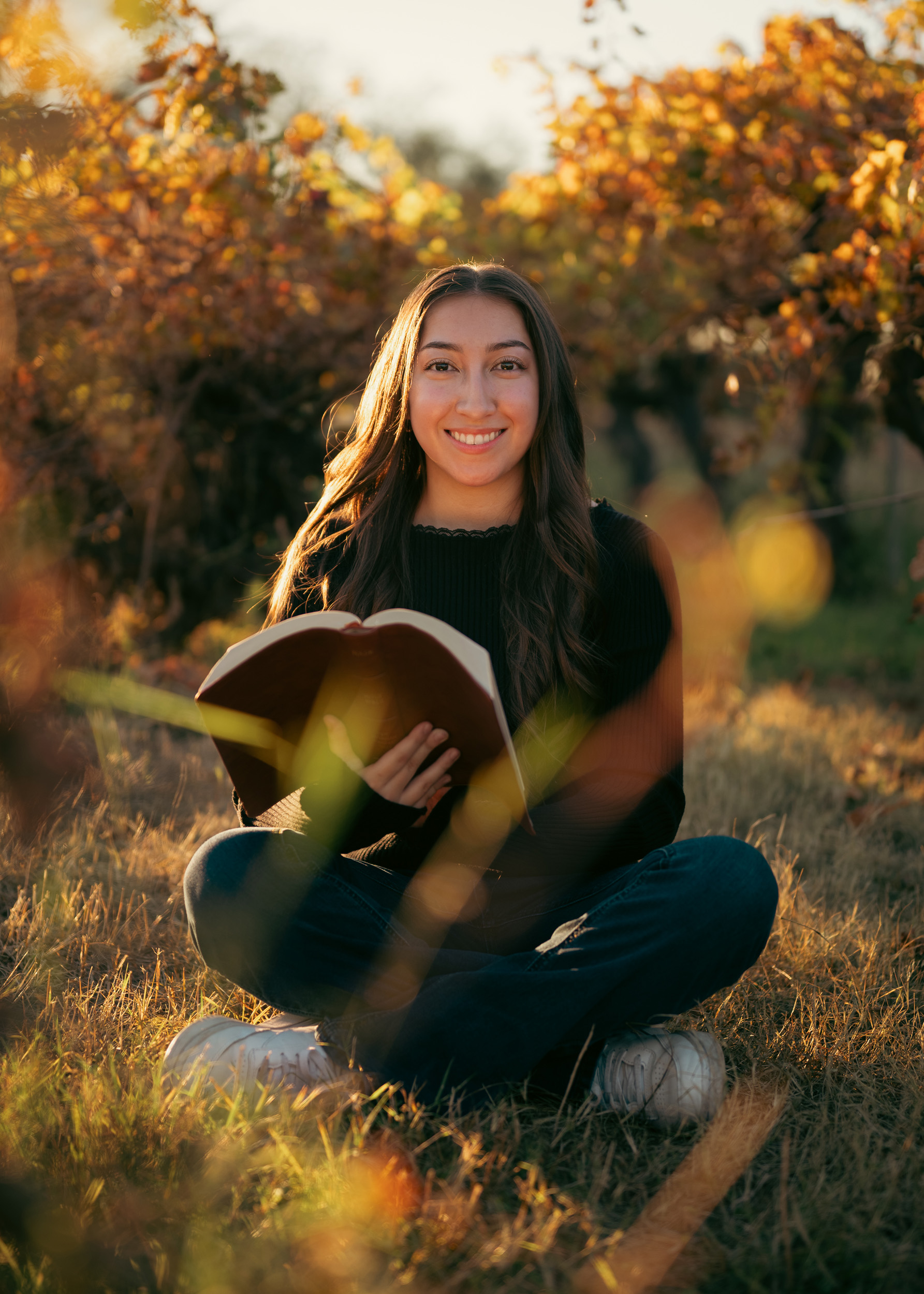 Girl sitting reading bible for senior portraits in Glendale, Arizona.