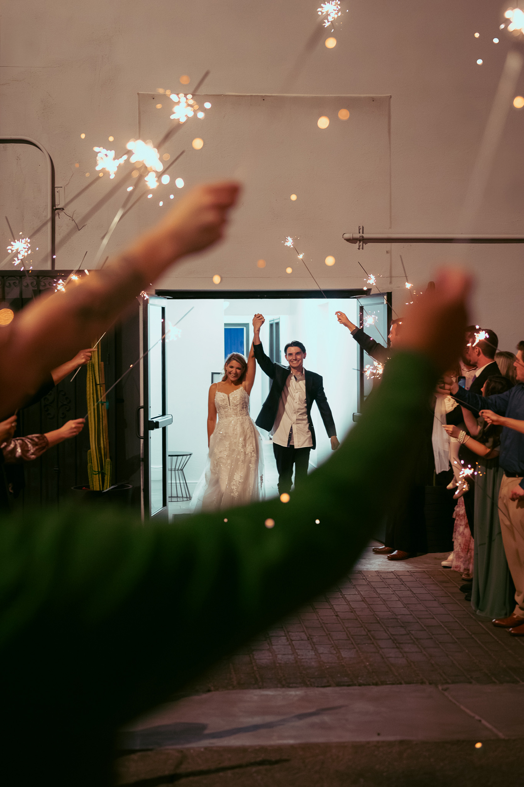 Bride and groom sparkler send off after wedding reception at Tre Bella by Wedgewood in Mesa Arizona.