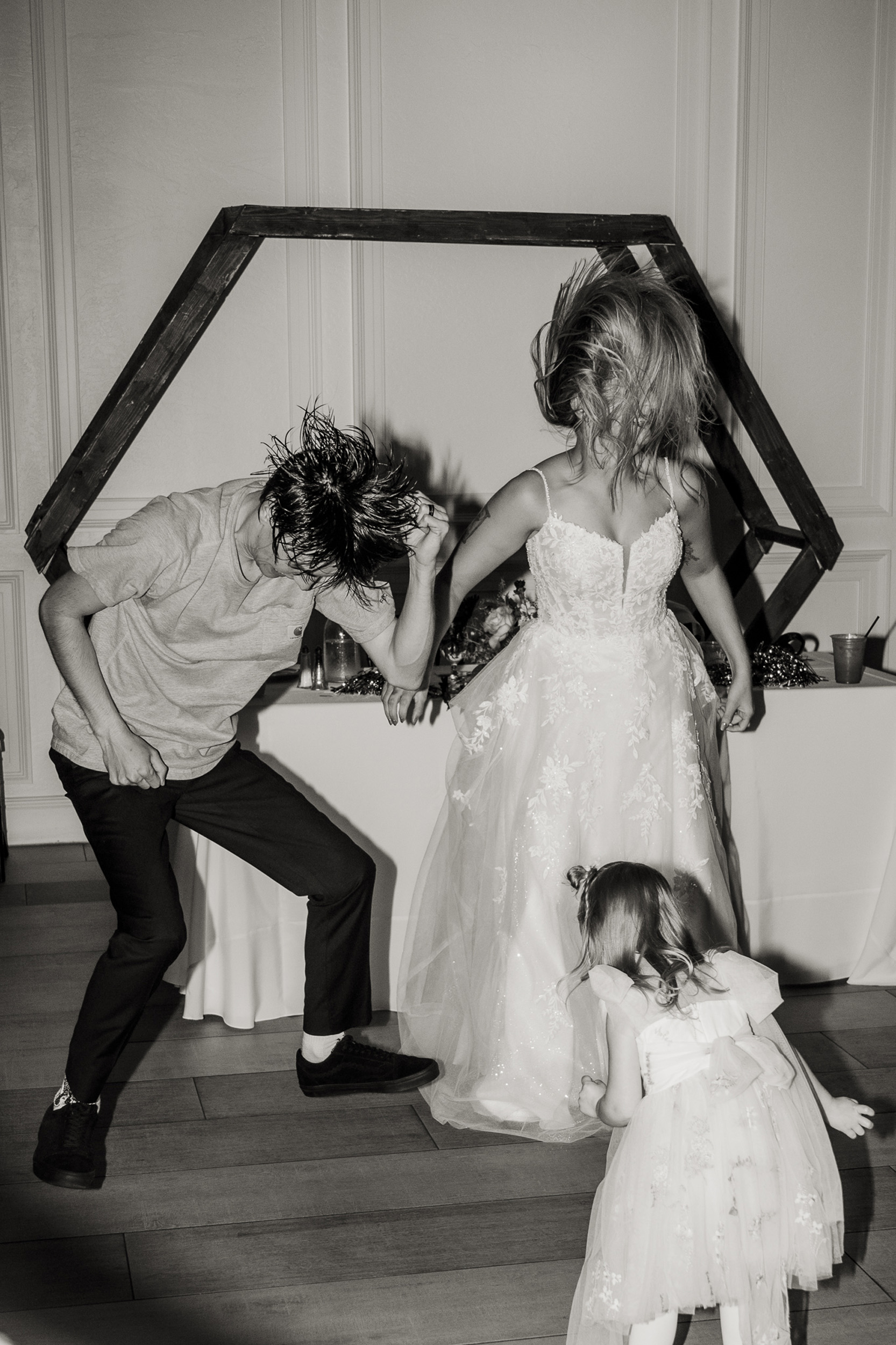 Bride and groom head bang dance at wedding reception at Tre Bella Mesa Arizona.