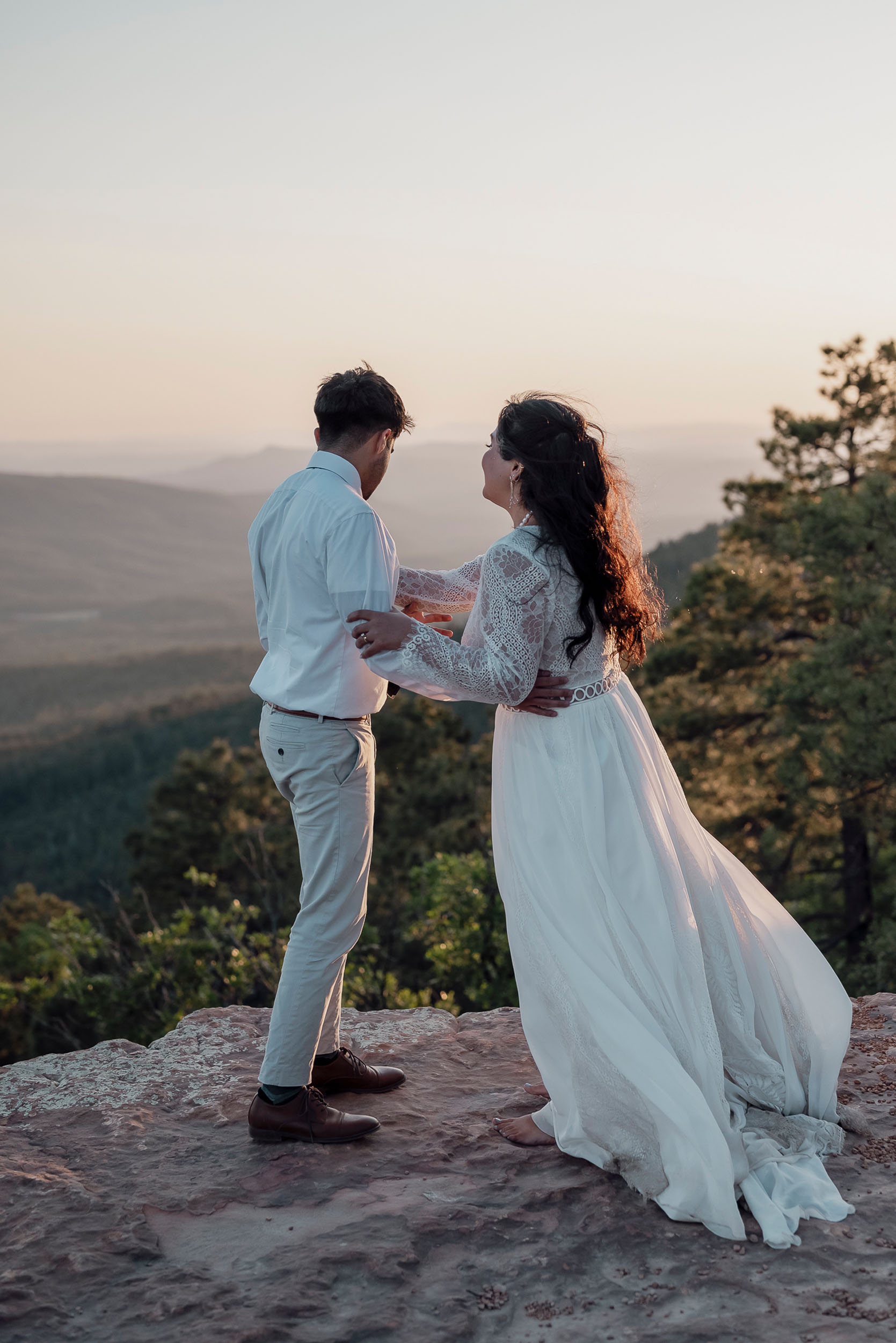 Bride and groom sharing happy moment during elopement wedding at the Mogollon Rim in Payson, Arizona
