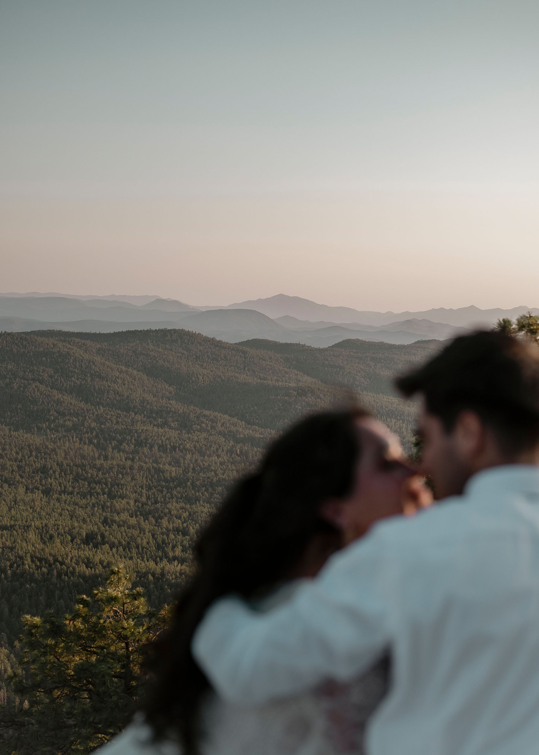 Bride and groom during elopement wedding at the Mogollon Rim in Payson, Arizona beautiful forest mountain backdrop