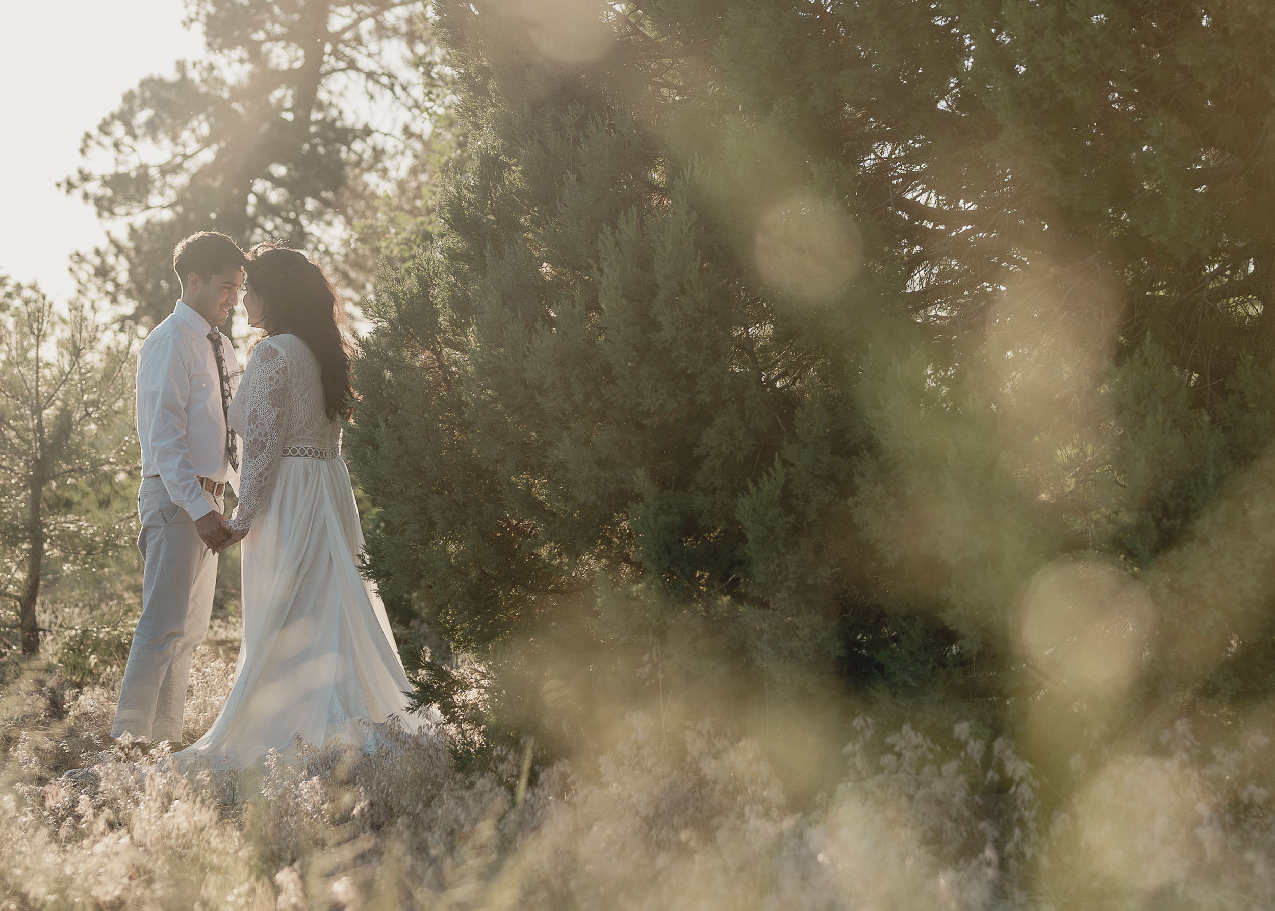 Bride and groom during elopement wedding in romantic forest setting at the Mogollon Rim in Payson, Arizona