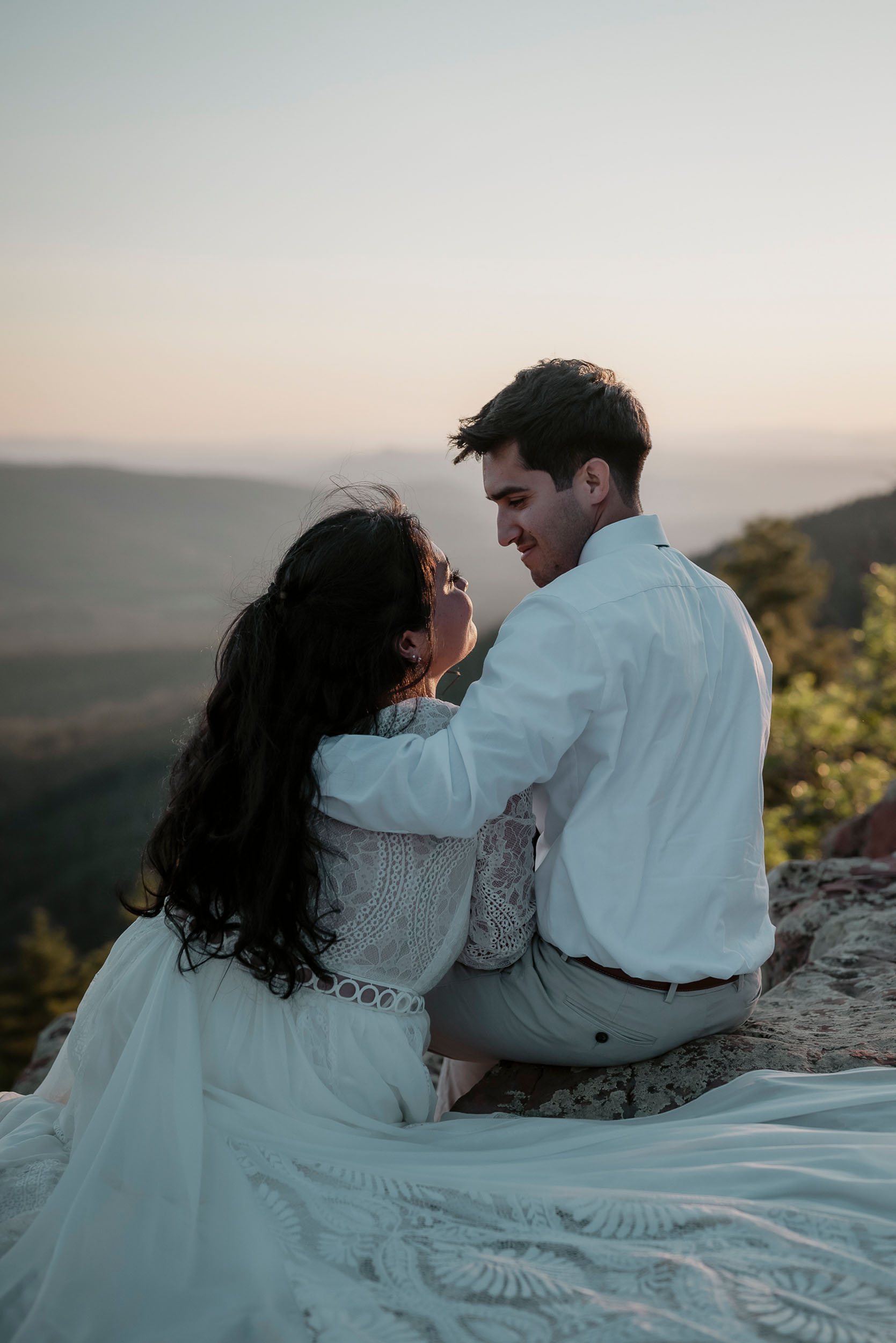 Bride and groom staring lovingly into each others eyes during elopement wedding at the Mogollon Rim in Payson, Arizona