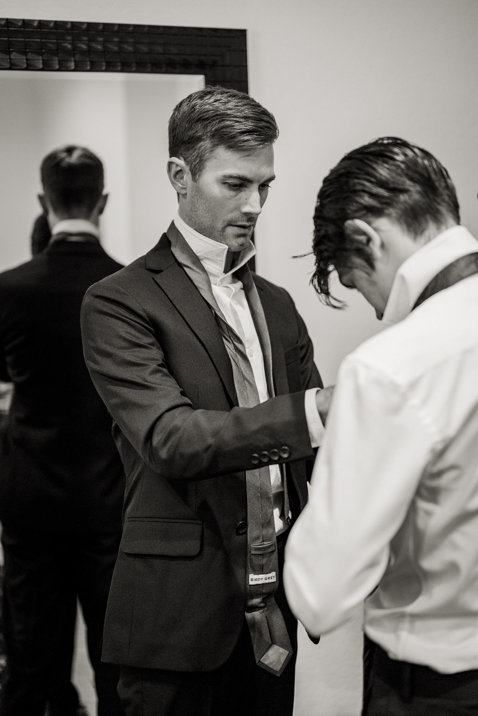 Groom and groomsman getting ready for wedding day at Tre Bella Mesa Arizona.