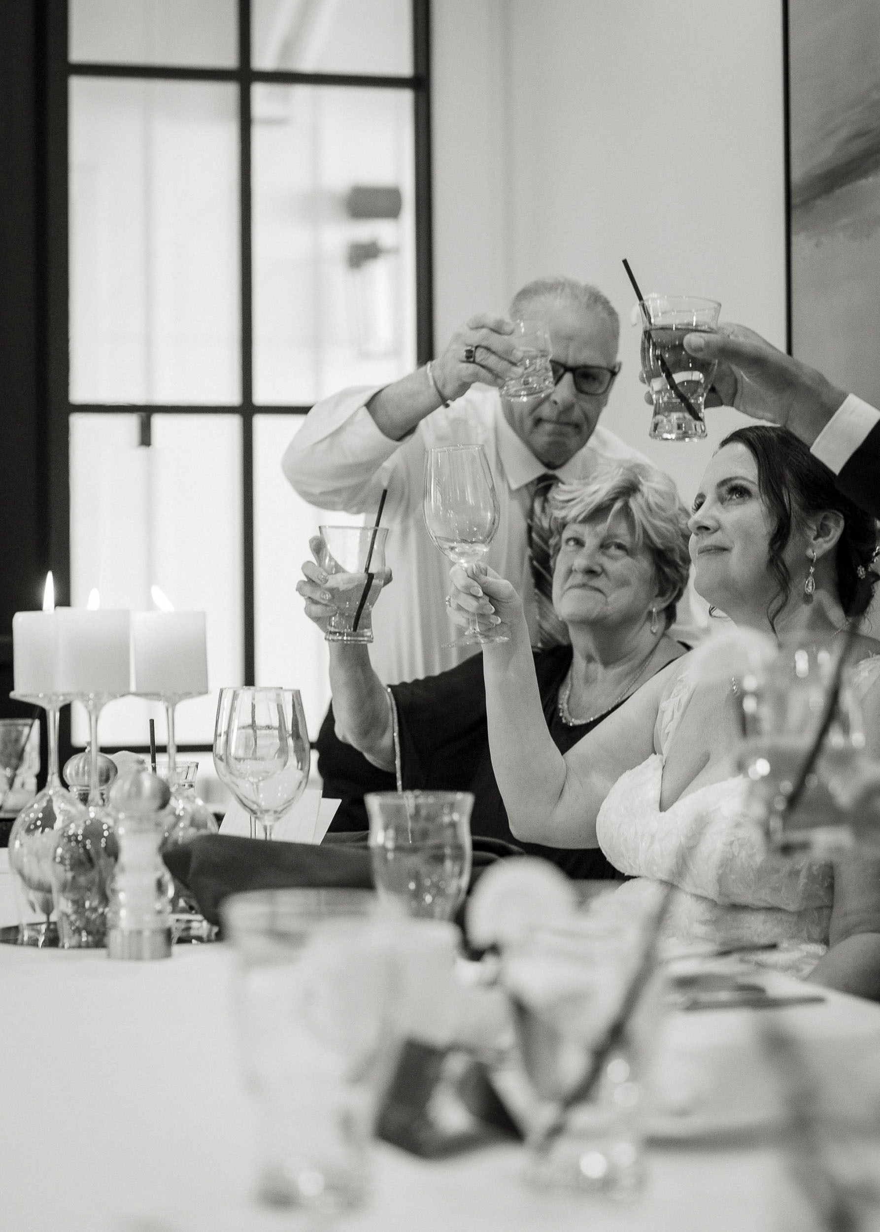 Bride groom and guests toasting celebrating at Sterling Grove Copper + Rye wedding reception