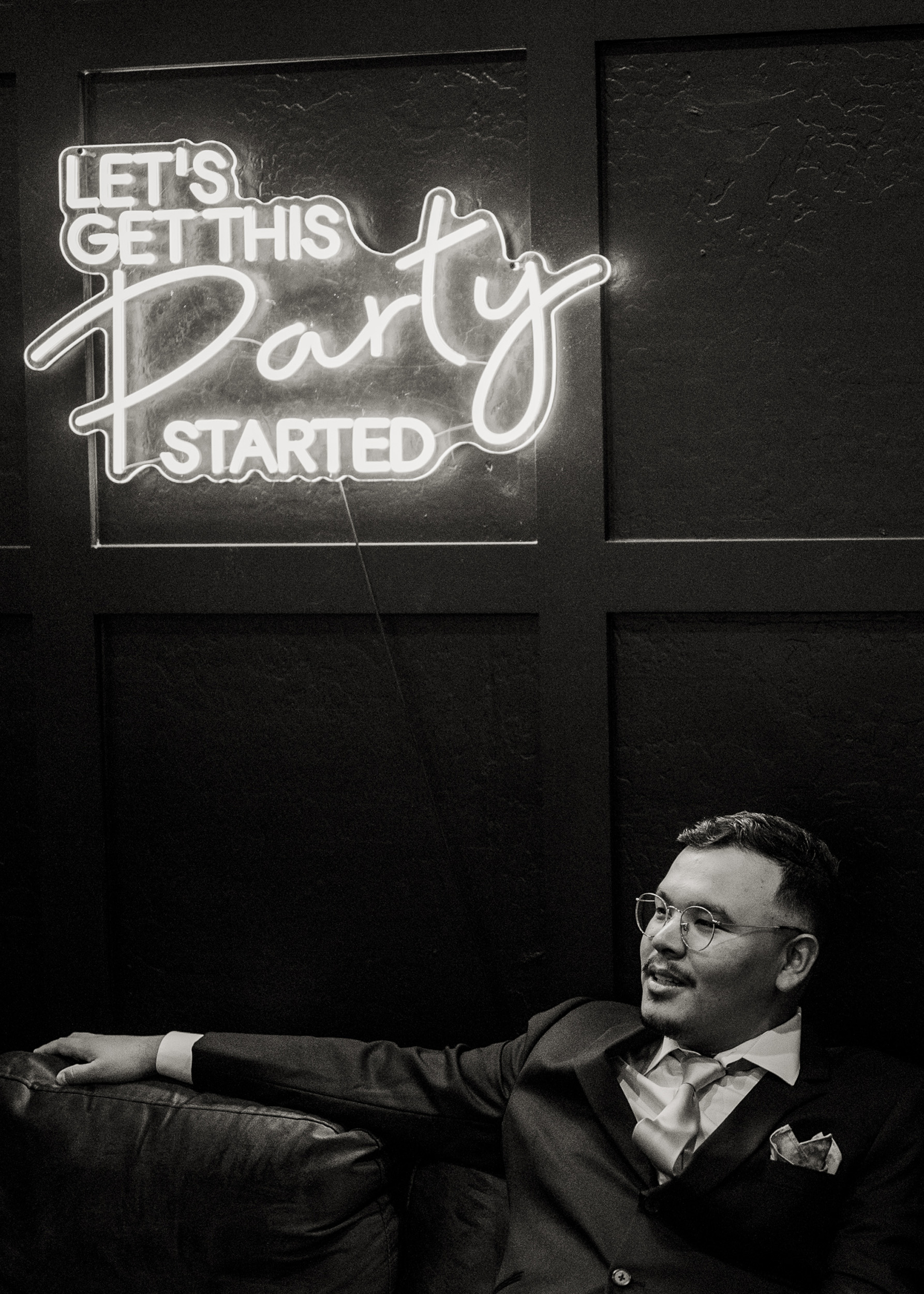 Groomsman sitting in dressing room at Tre Bella by Wedgewood Mesa Arizona.