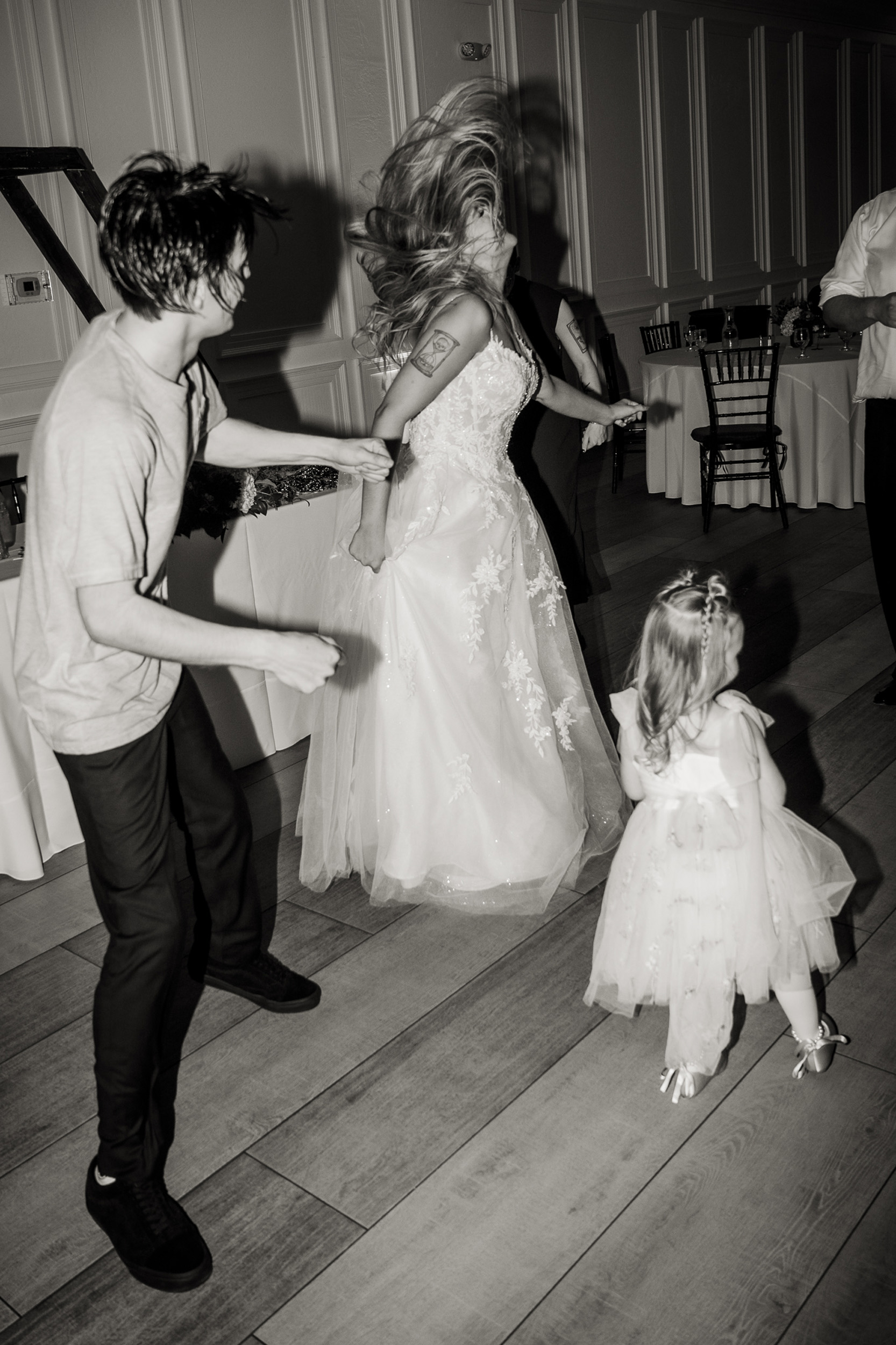 Bride and groom head bang dance at wedding reception at Tre Bella Mesa Arizona.