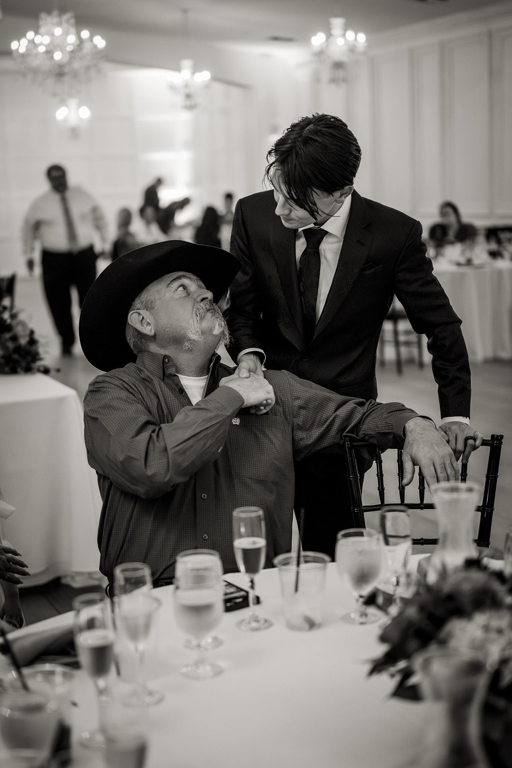 groom and  guest at wedding reception at Tre Bella by Wedgewood in Mesa Arizona.