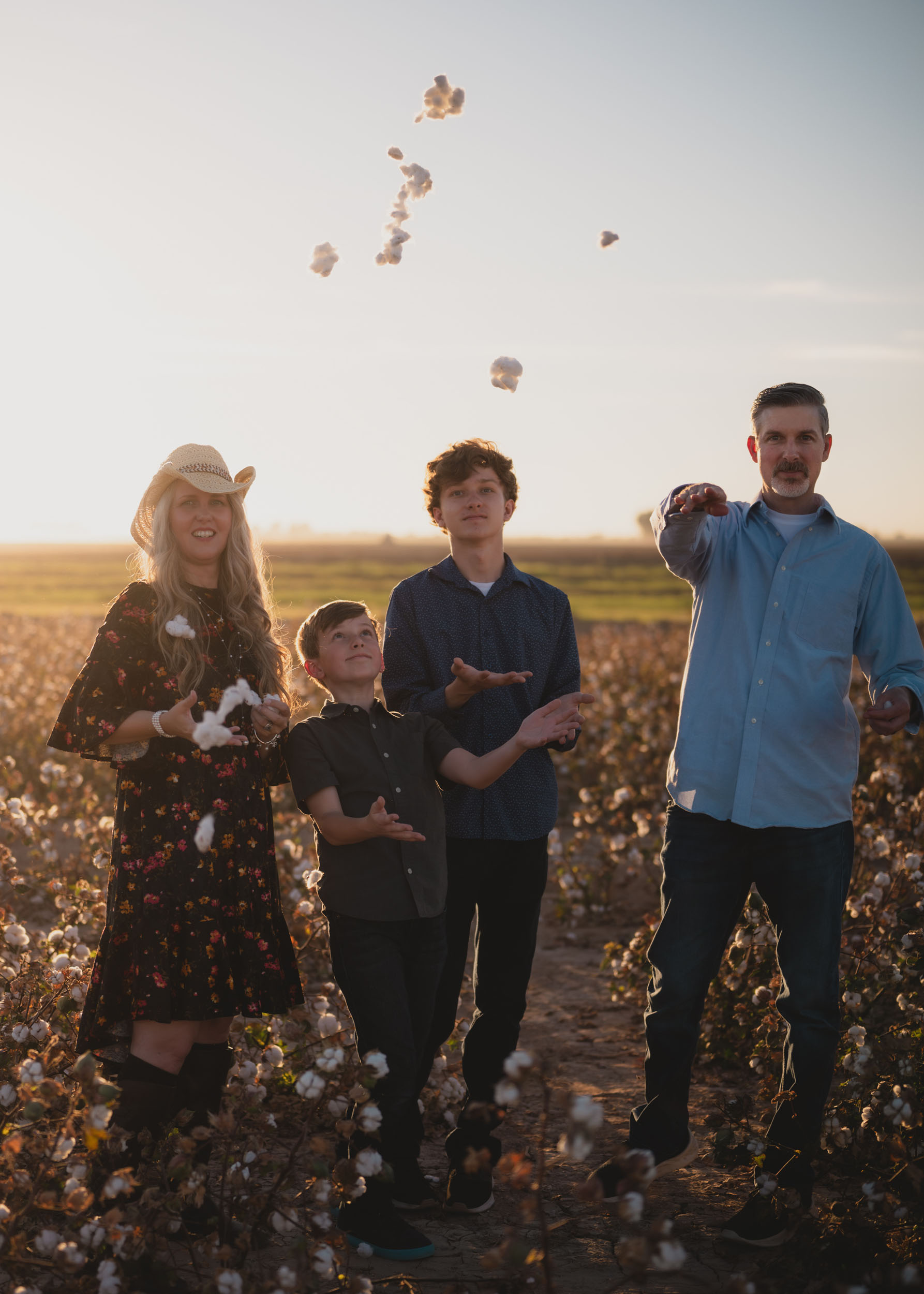 Family portrait in cotton field at golden hour at Rocker 7 Farm.