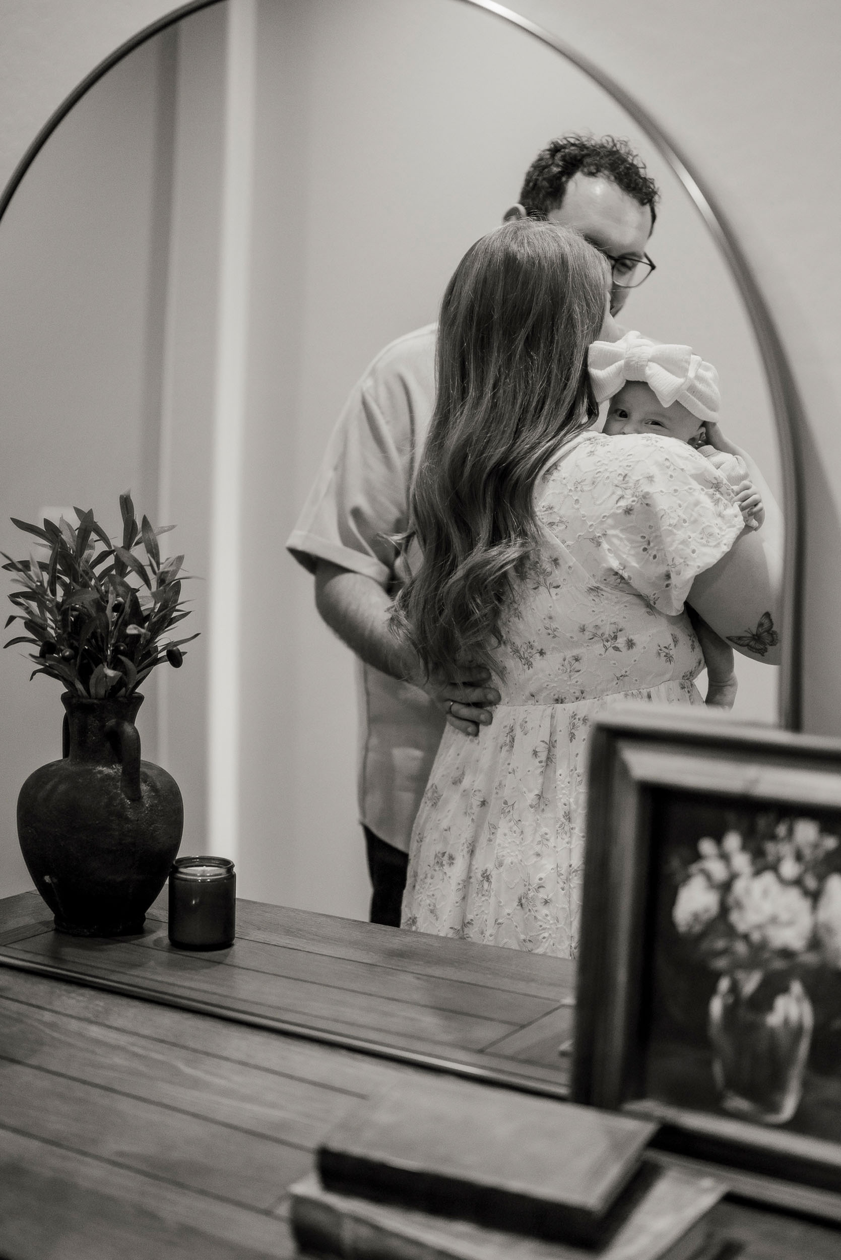 family holding newborn baby during lifestyle photo session