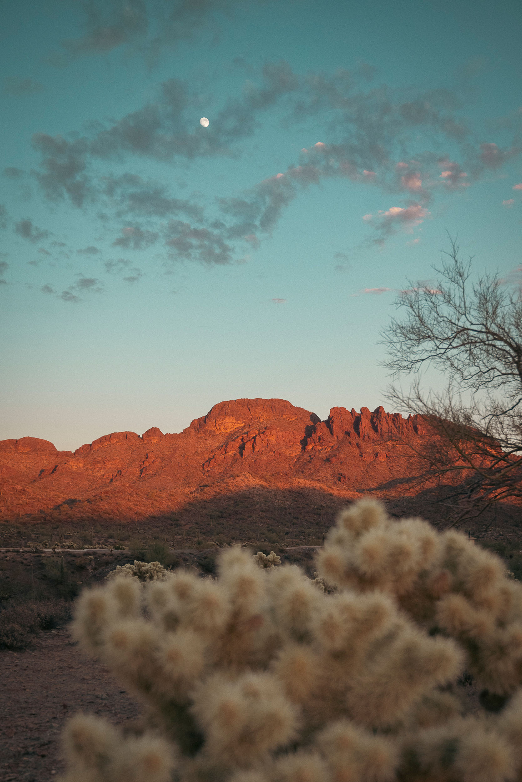 Golden light of the setting sun against Vulture Peak Mountain in Wickenburg, Arizona.