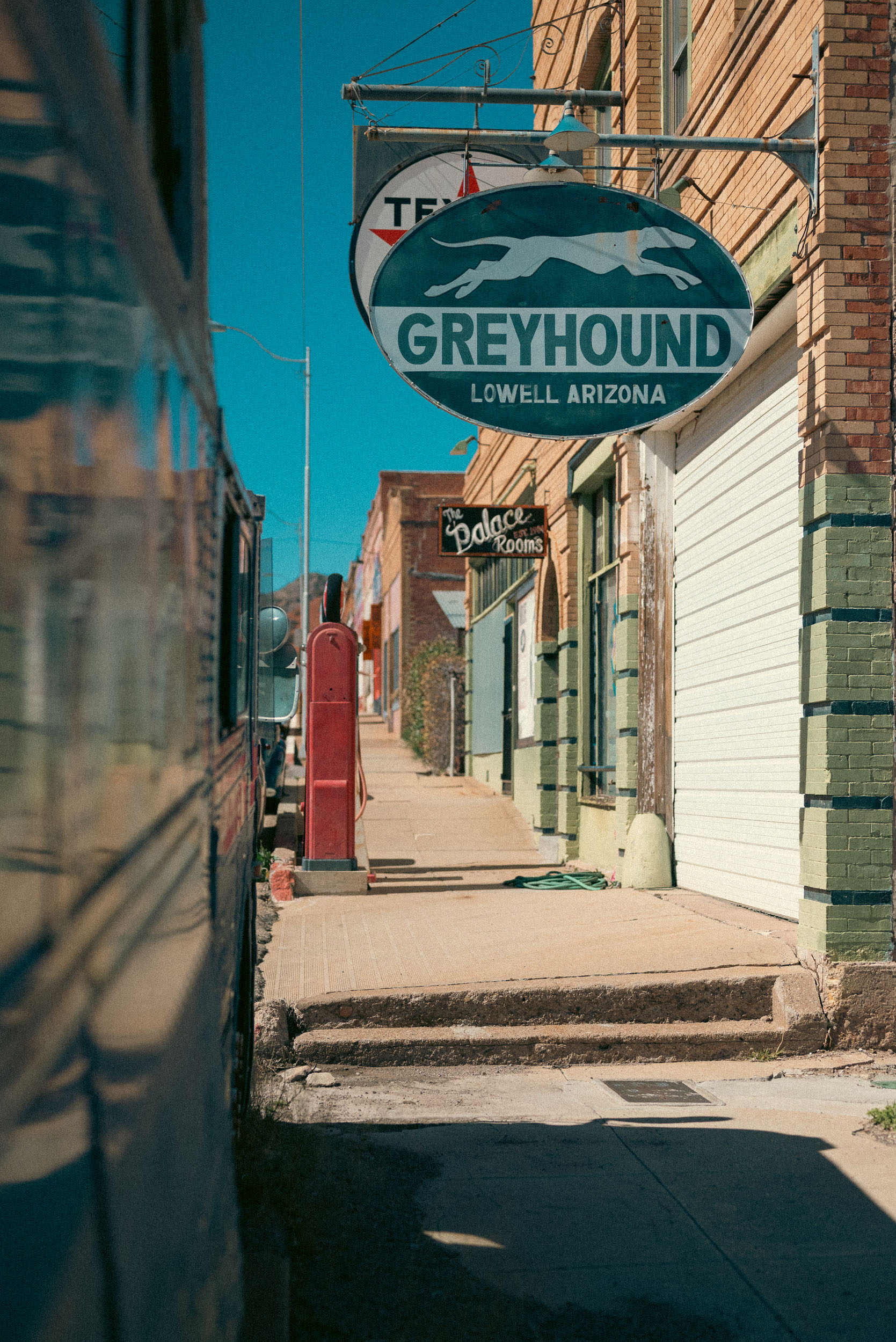 old time scene of a Greyhound bus station in Lowell Arizona